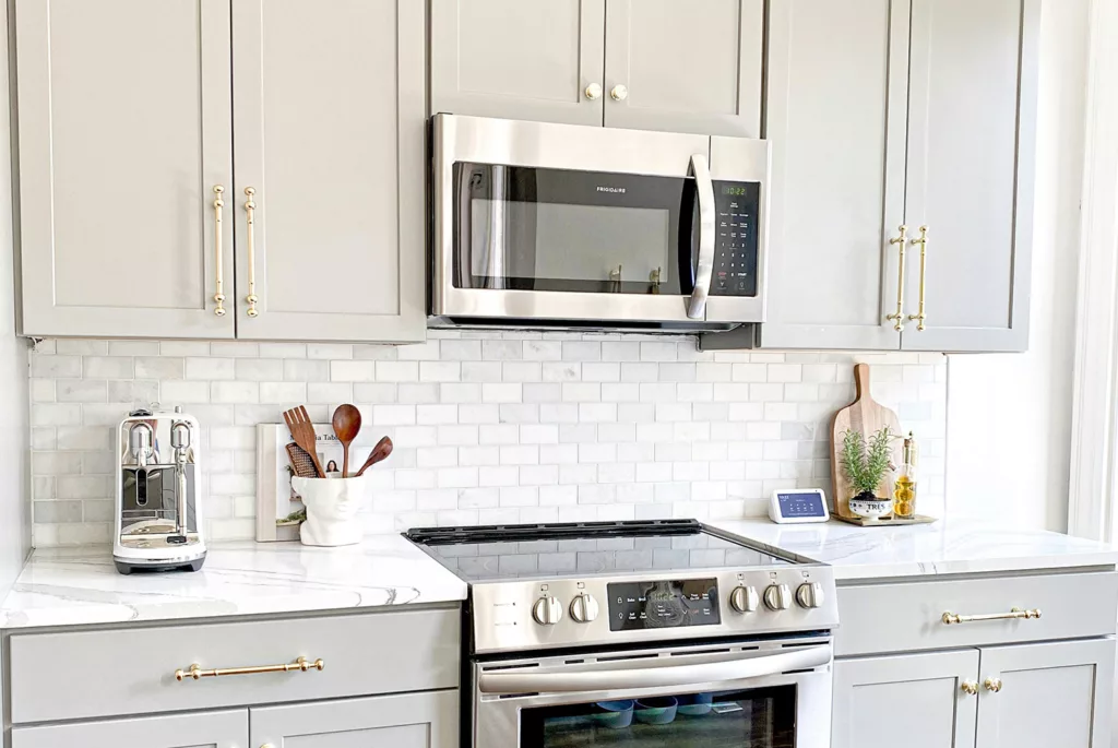 Contemporary kitchen featuring a stylish custom built-in microwave cabinet