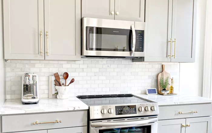 Contemporary kitchen featuring a stylish custom built-in microwave cabinet