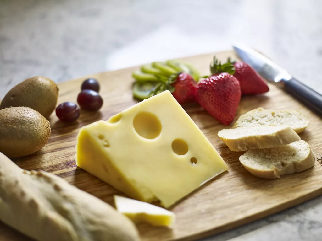 closeup of bread and cheese on a cutting board