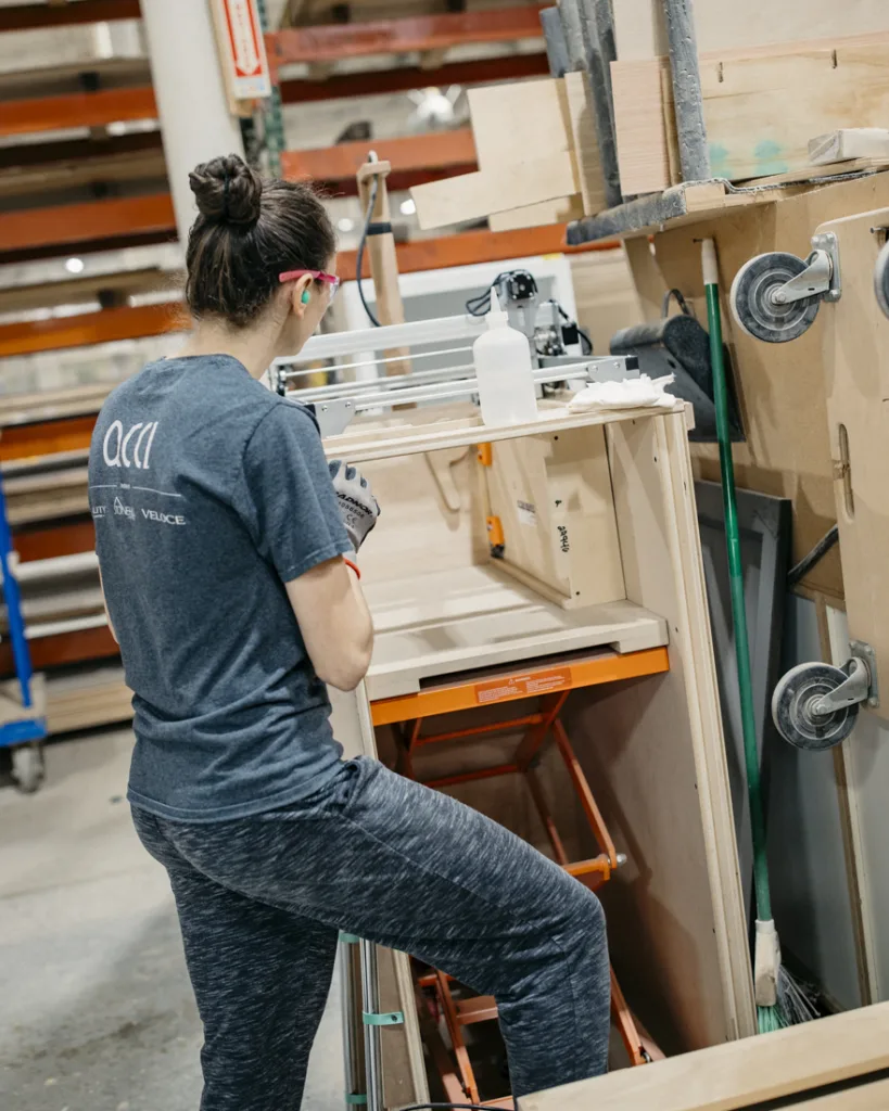 Person working on assembling cabinets
