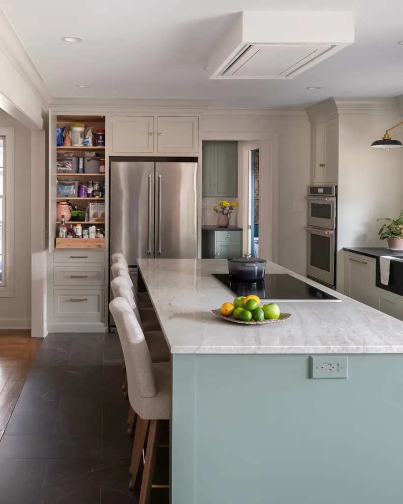 Custom cabinets in a kitchen with cabinet door open to show storage