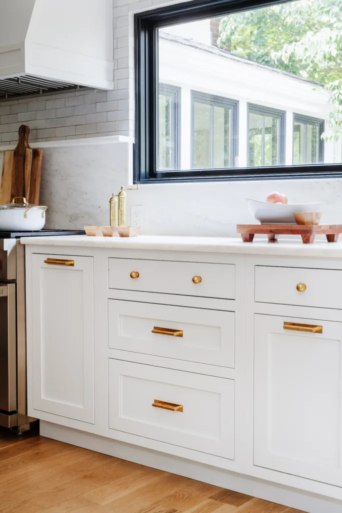 Light colored inset cabinets in custom kitchen
